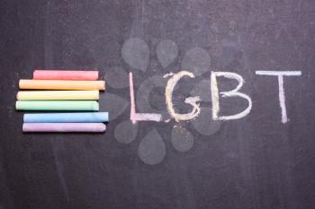 symbol of LGBT from crayons. The word LGBT is written on the blackboard