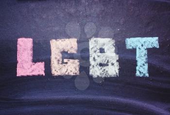 word LGBT on a chalkboard, a symbol of the color of the rainbow