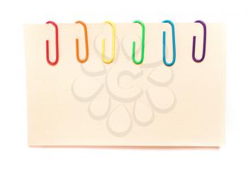 Space for text with paper clips stationery colors of the rainbow on a white background. Symbol, LGBT flag
