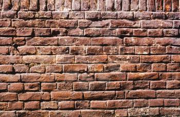 Abstract, brutal red brown background of bricks in a row.