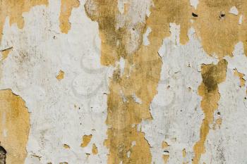 Grunge cement yellow, embossed, rough texture with shabby white paint, plaster
