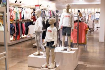 Children's clothing on mannequins, on hangers in stores. The concept of shopping, Sales.