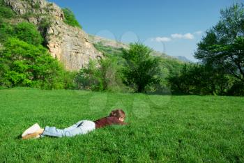 Girl resting on the meadow. 