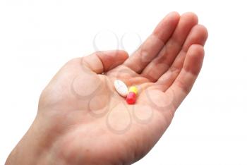 Human palm and two pills. Isolated object.