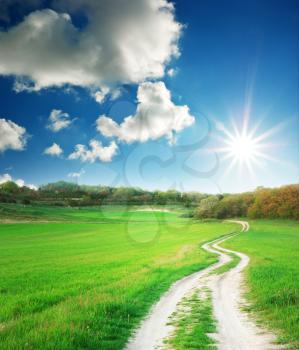 Lane in meadow and deep blue sky. Nature design.