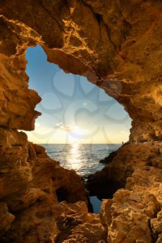 Sunset into grotto. Nature composition.