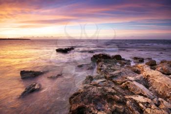 Beautiful seaascape. Sea and rock at the sunset. Nature composition.