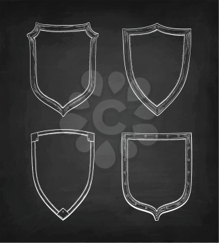 Set of banners. Chalk sketch of vintage shields on blackboard background. Hand drawn vector illustration. Retro style.