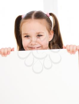 Little girl is holding blank banner