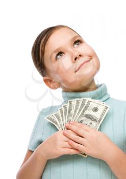 Cute girl with dollars, isolated over white