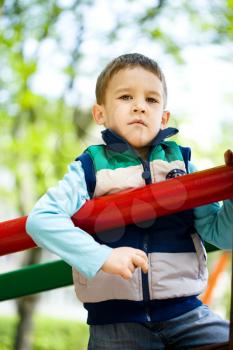 Cute little boy is playing on playground