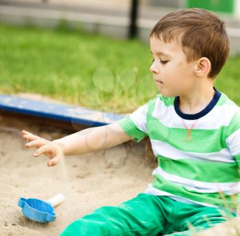 Cute little boy is playing on playground