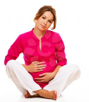 Image of pregnant woman touching her belly with hands, isolated over white