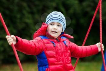 Cute little boy is playing on playground