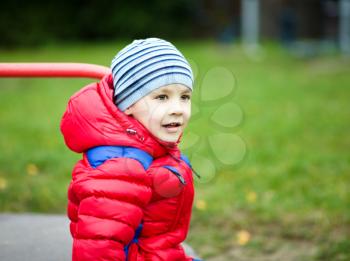 Cute little boy is playing on playground