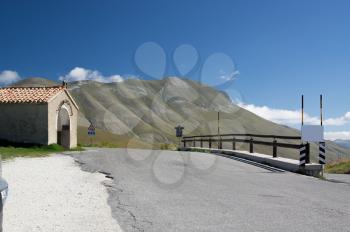 steep slope of the road in the mountains of Italy summer day