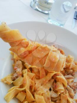 Italian typical dish of pasta cooked according to tradition with fresh seafood.