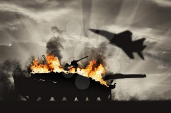 Concept of war and conflict. Destroyed tank, amid flying fighter