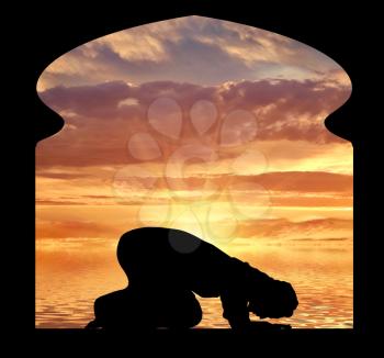 Islamic religion. Muslim Praying in the mosque at sunset