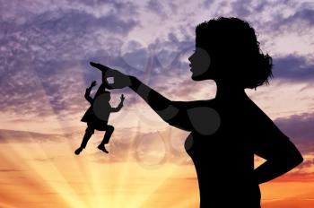 Silhouette feminist holding a small man. Concept of feminism.