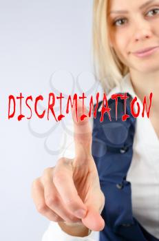 Discrimination concept. A woman clicks on word discrimination