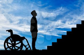 Concept of disability and disease. Silhouette of disabled person in front of the stairs