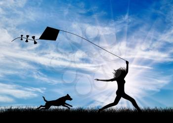 Silhouette girl sunset launch kite and runs with her dog. Concept friendship