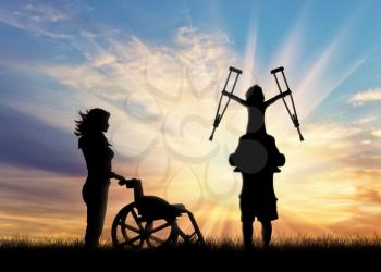 Disabled child on shoulders of father holding his crutches and wheelchair nurse sunset. Concept child disabled