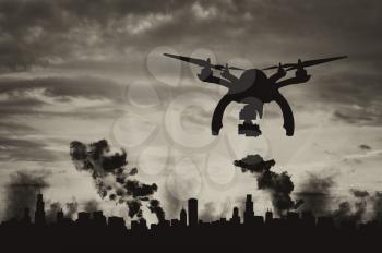 Silhouette flying reconnaissance drone over the city in smoke. Concept of military intelligence and information