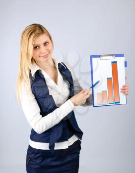Business concept. Business woman presents the company's revenue in the graph on the tablet