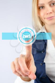 Woman presses on the touch icon car. On a light background