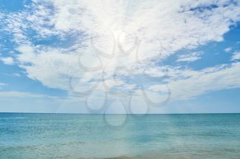 Sunny seascape on the background of the cloudy sky. Season summer