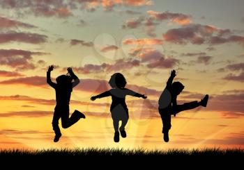 Concept of happiness. Silhouette happy children jumping at sunset