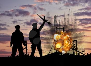 Concept of terrorism and acts of terrorism. Silhouette of terrorists and blow up the bridge at sunset