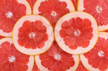 Cut the fruit of grapefruit. Close-up background texture