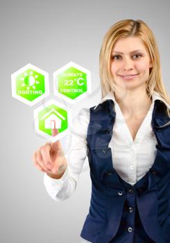 Smart home control concept. Business woman controls the smart home