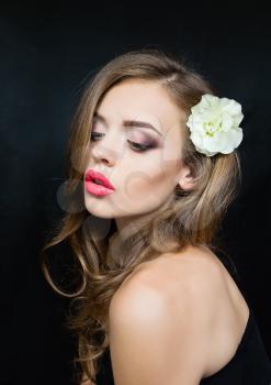 The portrait of a girl with red lips flower head