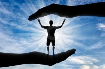 Happy disabled man with prosthetic hands and legs in hands of help. The concept of assistance and support for people with disabilities