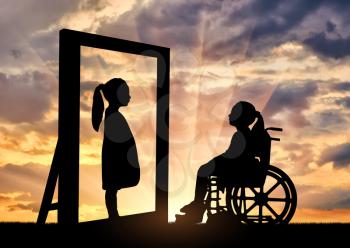 Silhouette of a girl a disabled child sitting in a wheelchair looking in the mirror and sees herself in a healthy reflection. Concept of children with disabilities in rehabilitation