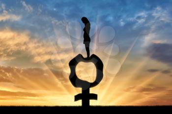 Silhouette of a sad woman standing on a female gender symbol that became flabby and wrinkled. Conceptual image of menopause in women