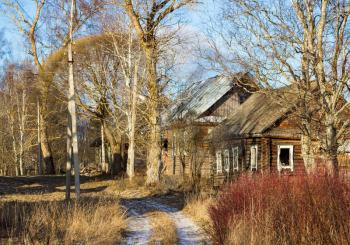 Sunny winter landscape with abandoned houses in the village of Palcevo.. Russia, Tver region, Bologovsky District.