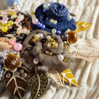 Embroidered flowers decorated with beads and pearls. handiwork.