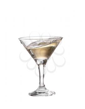 A martini glass on a white background; the water ripples and splashed as a green spanish olive with pimento is dropped into the glass; horizontal format