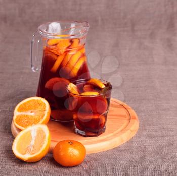 Cold refreshing drink from berries in glasses on the wooden table