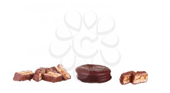 Tasty chocolate bar split in two pieces. Delicious caramel cream and peanuts inside.White background.