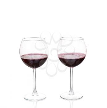 Two Wine Glasses with Red Wine on White Background