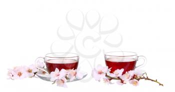 collage Cup of tea with a sprig of cherry blossoms isolated on white background.