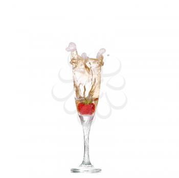 Single Strawberry splashing into a glass of champagne