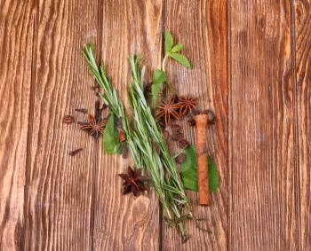 rosemary, cinnamon and mint on wooden