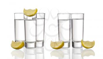 Three  tequila shots with lime isolated on white background